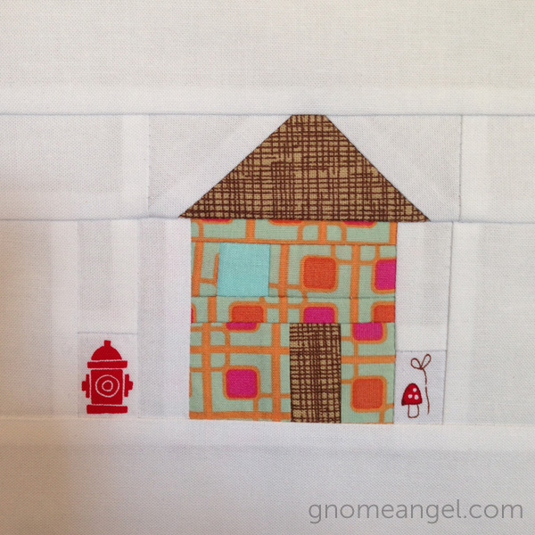 Angie's adorable little house. LOVE the fire hydrant detail!